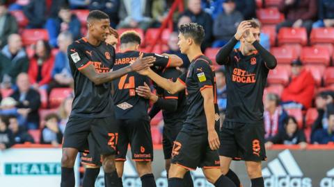 Blackpool players celebrate Anderson's goal