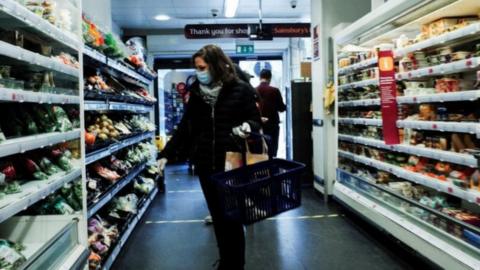 A shopper in Sainsbury's