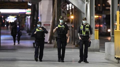 Officers patrol central Melbourne on 2 August 2020, after the curfew is introduced