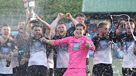 Haverfordwest players celebrate their play-off final victory