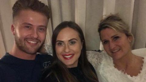 Josh Darcy with his sister and mother