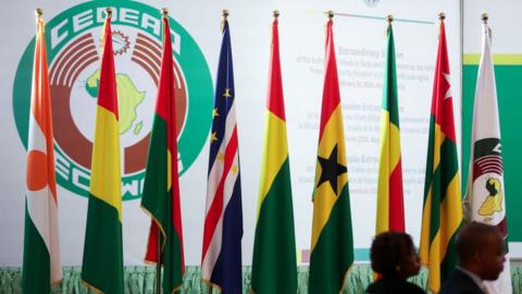 The Ecowas flag and logo at a meeting in Feburary in 2024.