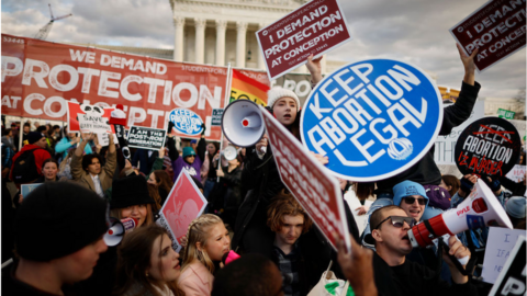 Anti-abortion and abortion rights activists protest during a rally