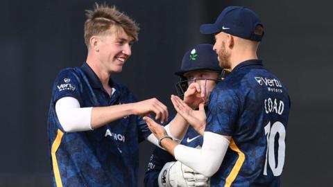 George Hill of Yorkshire celebrates the wicket of Kiran Carlson