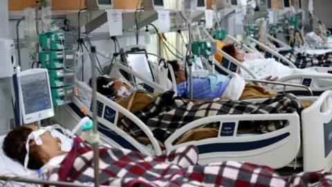 Patients are pictured in the emergency room of the Nossa Senhora da Conceicao hospital that is overcrowding because of the coronavirus disease (COVID-19) outbreak, in Porto Alegre, Brazil, March 11, 2021