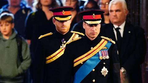 Prince William and Prince Harry, in military uniform.