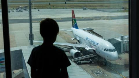 Person looking at an aeroplane