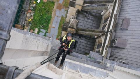 Adam Garre abseils from the West Towers
