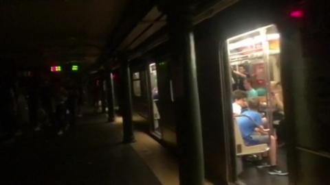 A subway train is seen during the New York power outage