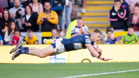 Leeds Rhinos' Ash Handley scoring a try