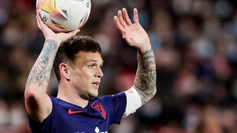 Kieran Trippier takes a throw-in for Atletico Madrid