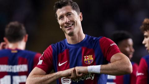 Robert Lewandowski celebrates scoring for Barcelona