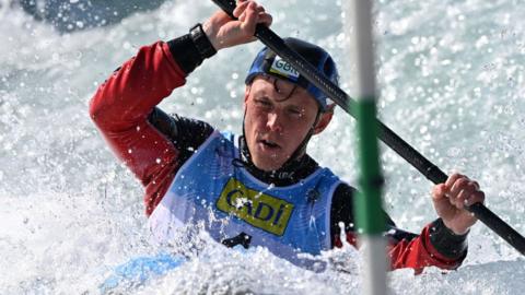 Joe Clarke paddling in his canoe