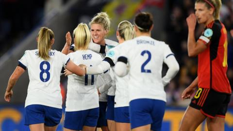 Millie Bright celebrates with her England team-mates