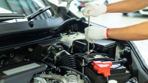 Mechanic checking car