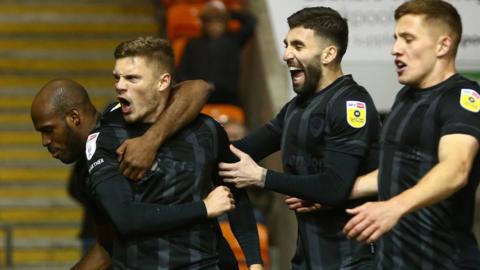 Regan Slater celebrates Hull's third goal at Blackpool