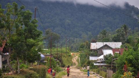 Children seen playing in Lemban Tongoa Village in Central Sulawesi two days after the gruesome attack