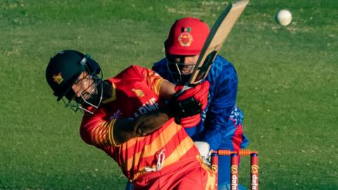 Zimbabwe's Sikandar Raza plays a shot against Afghanistan