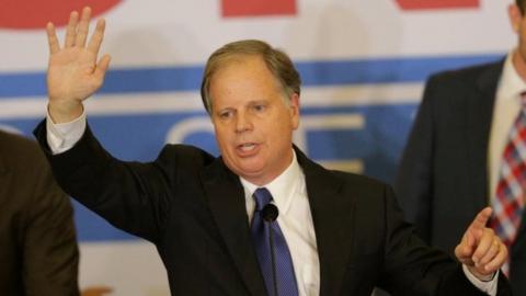 Democrat Doug Jones celebrates his win in Alabama