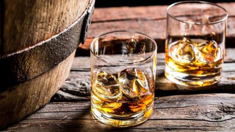 Whisky glasses and barrel