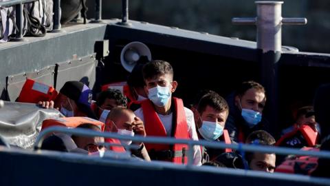 A group of people thought to be migrants are brought in to Dover from a Border Force vessel following a small boat incident in the Channel