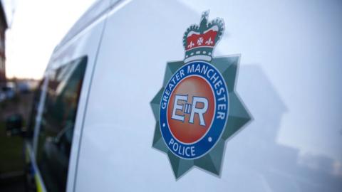 Greater Manchester Police badge on van