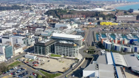 A aerial photo of some of St Helier, including tall buildings which are part of its finance business sector