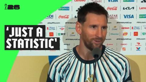 Lionel Messi speaks into a microphone following Argentina's win over Algeria