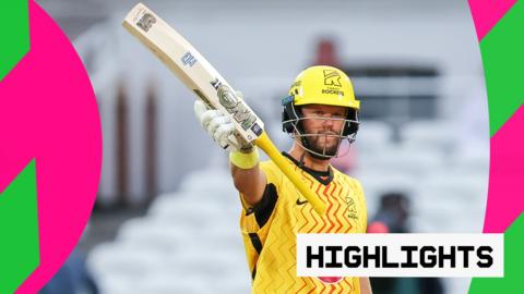 Ben Duckett holds his bat aloft after hitting a 50