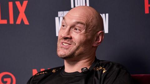 Tyson Fury speaks at a media day