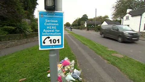 Floral tributes left on Egginton Road in Etwall
