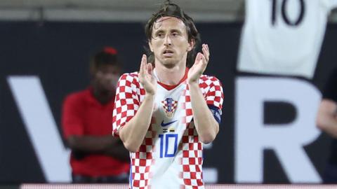 Luka Modric claps at the end of a match for Croatia 