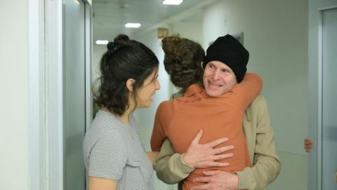 Released American-Israeli hostage, Keith Siegel, who was seized during the deadly October 7, 2023 attack by Hamas, embraces a loved one as he is reunited with his wife Aviva, his daughters Ilan, Gal and Shir and brother, Lee, at Sourasky Medical Center (Ichilov) in Tel Aviv, Israel, in a handout photo obtained by Reuters on February 1, 2025. 