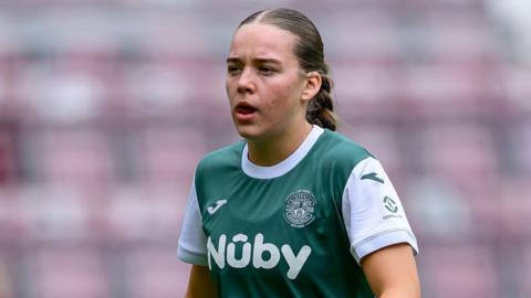 Rosie Livingstone wearing a Hibernian shirt