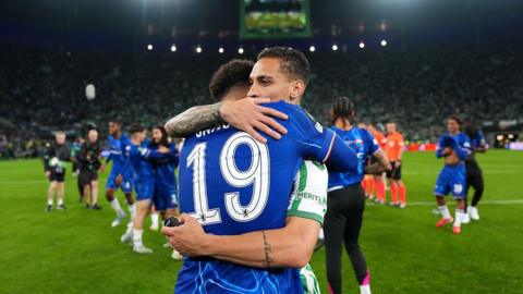 Jadon Sancho and Antony embrace after the Conference League final