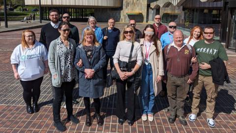 people wearing the simulation spectacles outside Newcastle Civic Centre