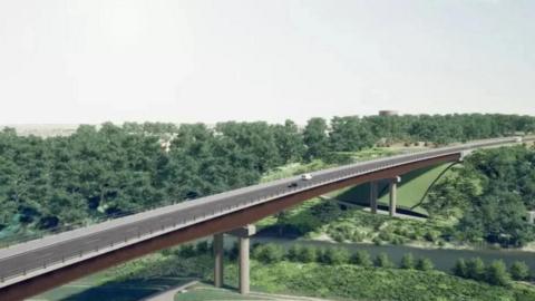 A drawing of a planned road bridge over green fields and trees with a river running below it