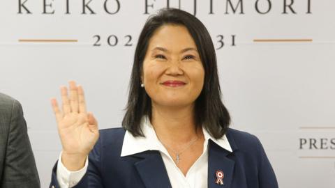 Peru's president-elect Keiko Fujimori waves as she gives a statement at her campaign headquarters in the San Borja district of Lima on Friday.