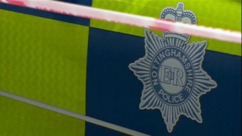 The side of a Nottinghamshire Police vehicle showing the force's crest