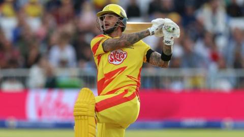 Alex Hales of Nottinghamshire sends the ball to the boundary