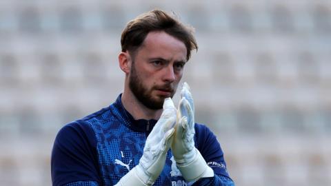 Conor Hazard applauding the fans during the warm-up before a match.