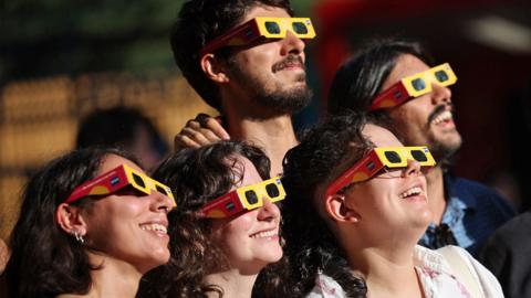 People watch the solar eclipse in Paredes de Coura, Viana do Castelo, Portugal, 12 August 2026.