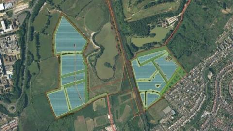 An aerial shot showing a blue outline on top of the green grasslands area that the solar farm will be built on