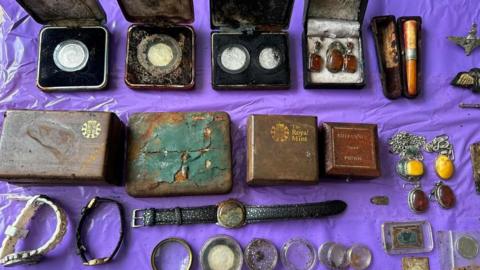 Medals and jewellery found during a litter pick in Plymouth