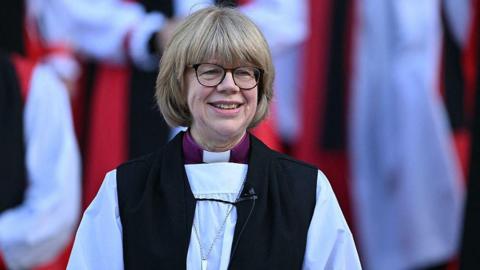 The new Archbishop of Canterbury Sarah Mullally smiles on the steps of St Paul's Cathedral after taking part in a 'Confirmation of Election' ceremony in London