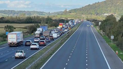 View of the M5 from above. The southbound carriageway is gridlocked, while the northbound carriageway is deserted.