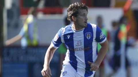 Alex Woodyard in action for Colchester United