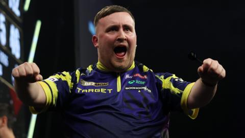 Luke Littler celebrates