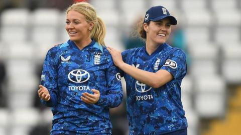 England's Sarah Glenn (left) celebrates a wicket with captain Nat Sciver-Brunt