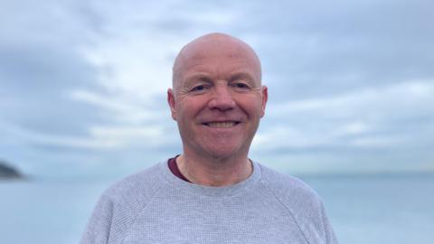 Martin Longmore smiling on Larne Promenade